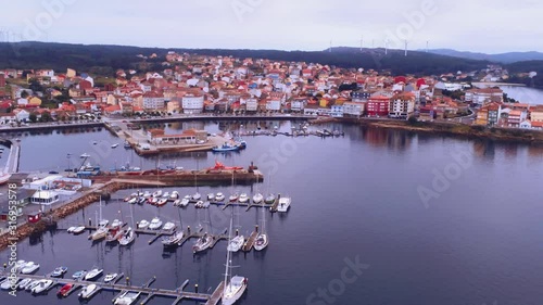 Beautiful landscape of Camarinas, coastal  village of Galicia during daytime. Aerial flying backwards photo