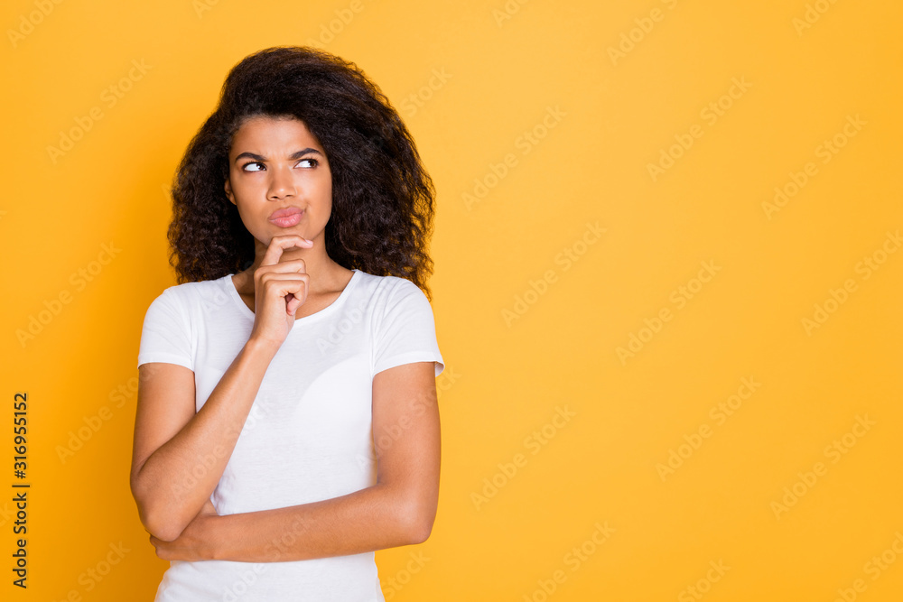 Photo of pensive concentrated focused girl looking thoughtfully into empty space touching her chin isolated vivid color background Photo of pensive concentrated focused girl looking thoughtfully into empty space touching her chin isolated vivid color background