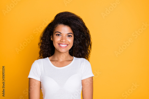 Photo of charming fascinating cute girl standing confidently looking into camera near empty space isolated brigth color background