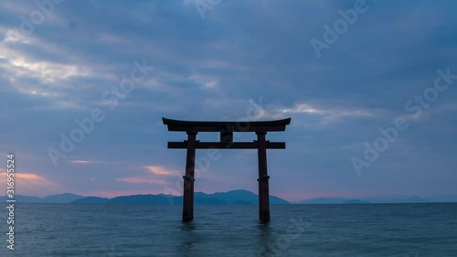 Timelapse footage of sunrise at Shirahige shrine torii gate, lake Biwa, Shiga Prefecture, Japan