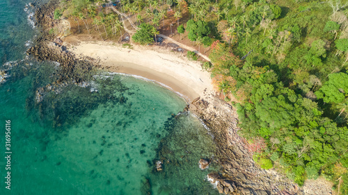 Aerial drone view of tropical beach from above, sea, sand and palm trees island beach landscape, Thailand