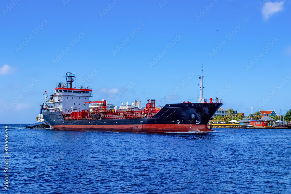 Tanker ship entering Willemstad , Konigin Juliana Bridge in the background Curacao