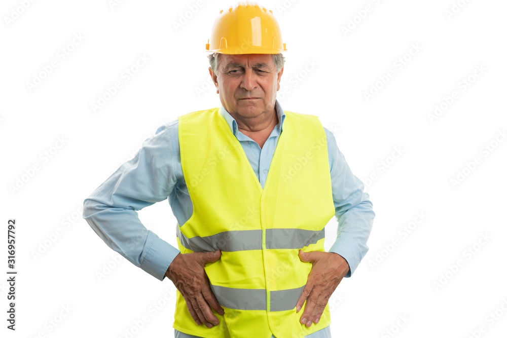 Construction worker touching stomach Construction worker touching stomach
