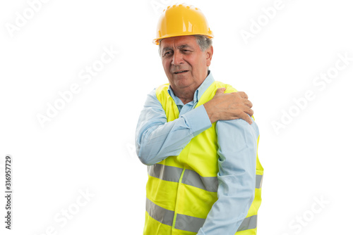 Builder touching painful arm