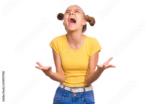 Emotional portrait of teen girl screaming, isolated on white background. Beautiful caucasian young teenager. Crying angry child with raised hands. Human emotions, facial expression concept.
