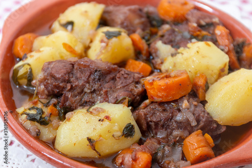 rustic meal of ox tail with potato and carrot