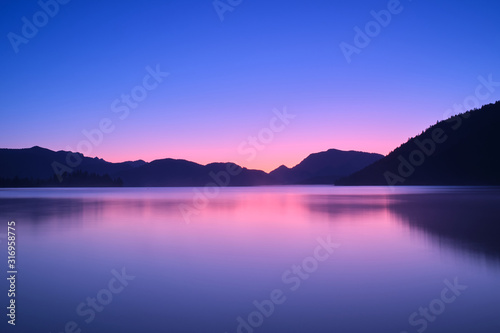 Sunrise over a lake in the Alps © Berg