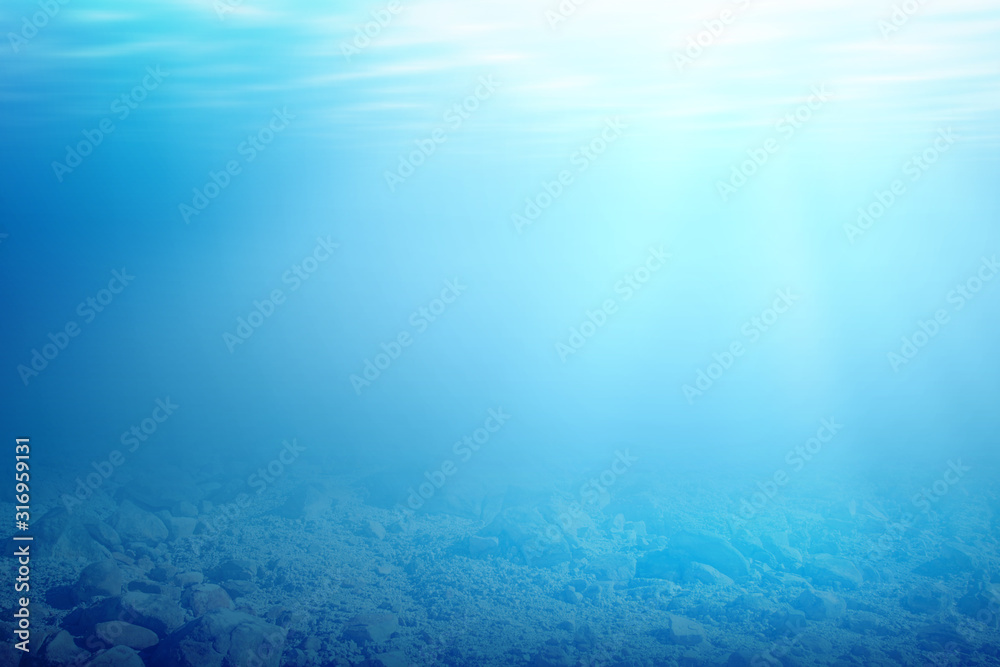 Underwater view of blue water and sunlight