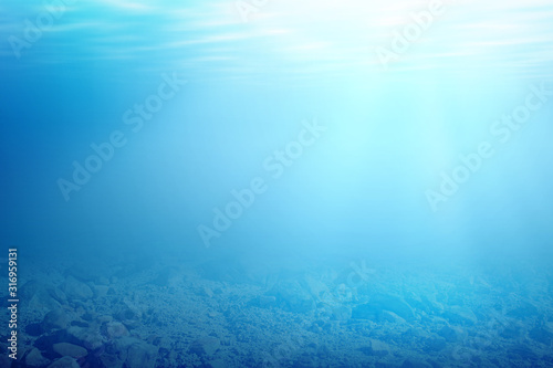 Underwater view of blue water and sunlight