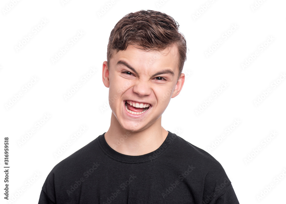 Emotional portrait of upset and angry teen boy isolated on white background. Child looking camera with serious face. Handsome caucasian young teenager with problems. Emotional portrait of upset and angry teen boy isolated on white background. Child looking camera with serious face. Handsome caucasian young teenager with problems.