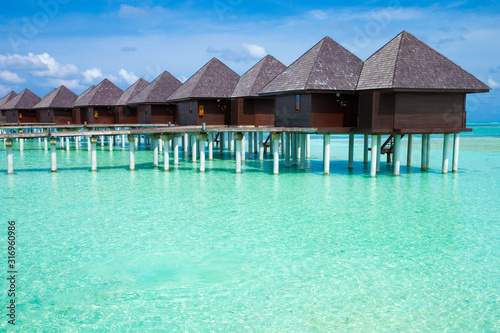 Fototapeta Naklejka Na Ścianę i Meble -  Beautiful tropical Maldives island with beach. Sea with water bungalows