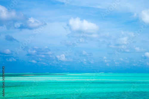 Beautiful tropical Maldives island with beach. Sea with water bungalows