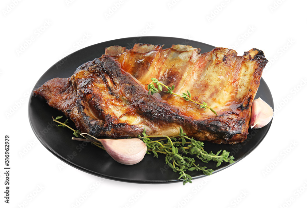 Tasty grilled ribs with thyme and garlic isolated on white