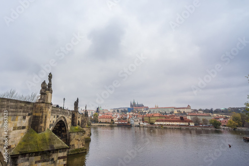 Panorama of the Old Town of Prague  Czech Republic  with a focus on Charles bridge  Karluv Most   and the Prague Castle  Prazsky hrad  seen from the Vltava river. The castle is main touristic landmark