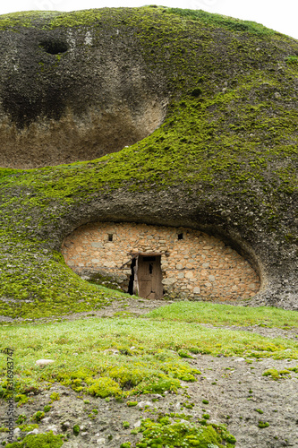 Meteora, Greece - Dec 19, 2019: Abandoned monastic cave houses known as "cells" in Meteora (meaning "suspended into air") in Trikala, Greece