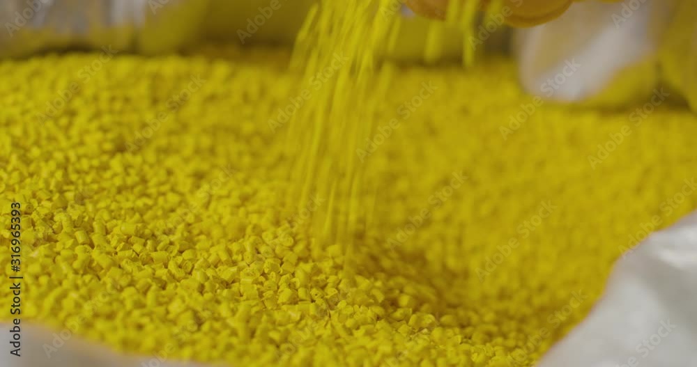 hands holding a pile of plastic pellets, Plastic beads for factory, Slow Motions hands holding a pile of plastic pellets, Plastic beads for factory, Slow Motions