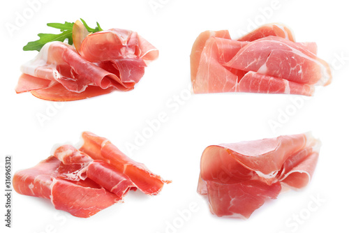 Set of delicious sliced jamon on white background photo
