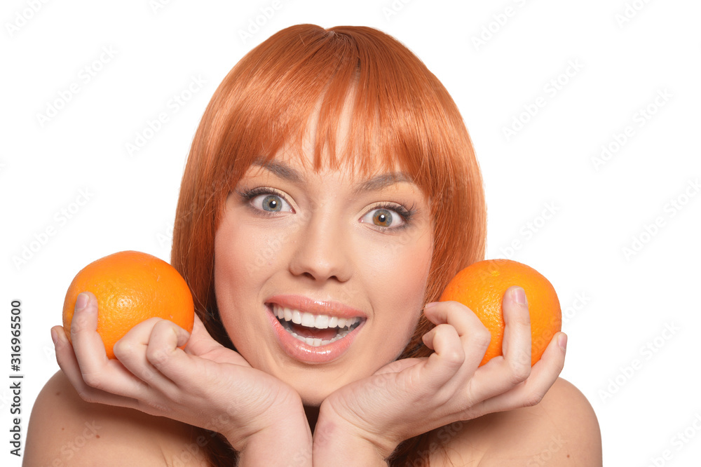 Portrait of young woman posing with oranges Portrait of young woman posing with oranges