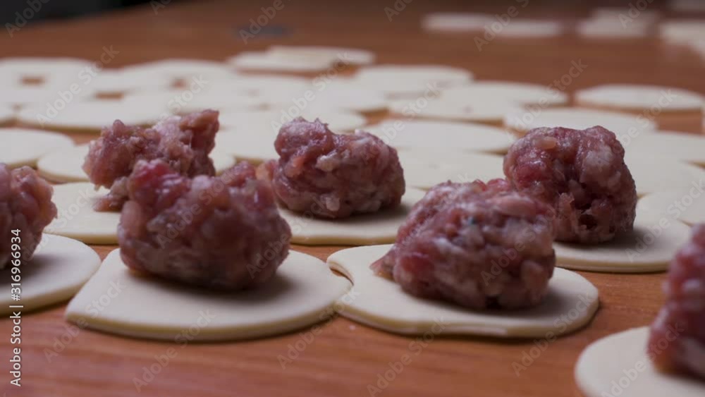 Worker sculpts dumplings, a large number. Worker sculpts dumplings, a large number.
