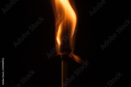 Ignition of match with sparks isolated on black background space for text fire concept passion figures variety