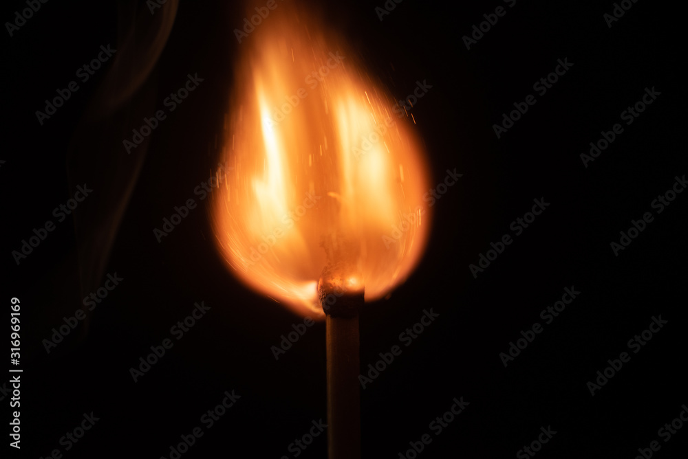 Ignition of match with sparks isolated on black background space for text fire concept passion figures variety
