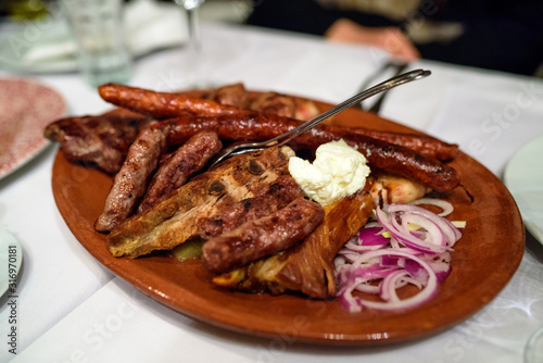 Plate with mixed traditional Serbian meat. Serbian national cuisine photo