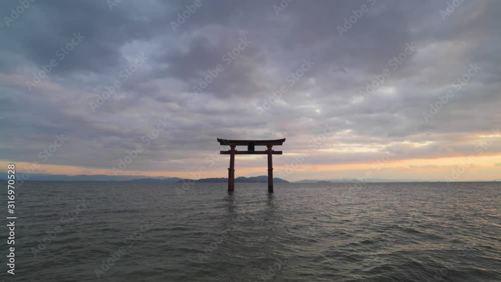 Sunset at Shirahige shrine torii gate, lake Biwa, Shiga Prefecture, Japan Sunset at Shirahige shrine torii gate, lake Biwa, Shiga Prefecture, Japan