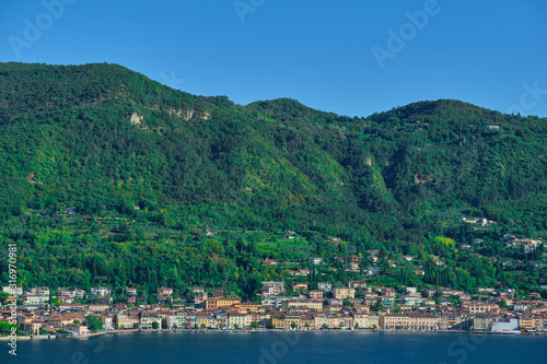 Panoramic view of the center of Salo, Italy. Lake Garda, blue sky, mountains © Berg