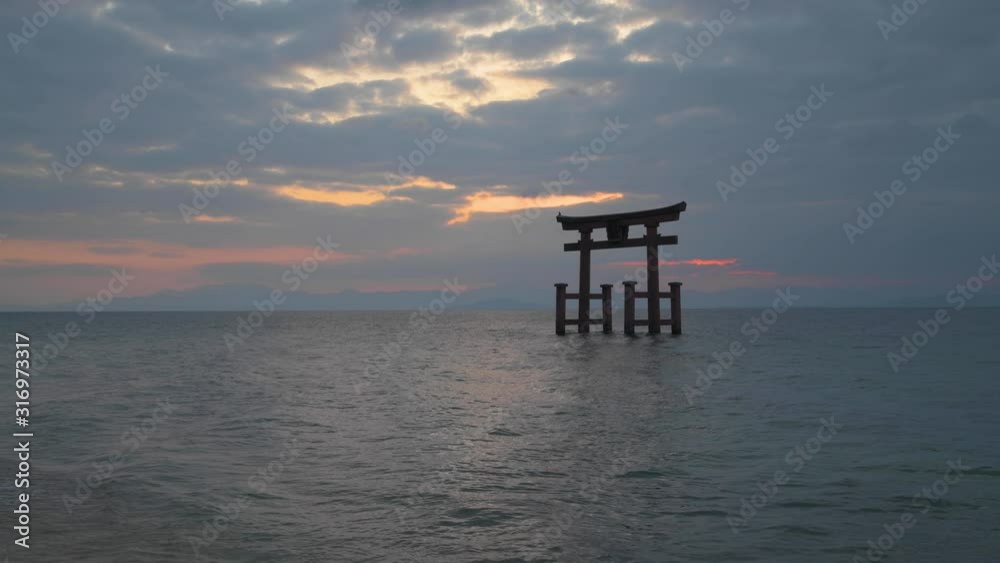 Sunrise at Shirahige shrine torii gate, lake Biwa, Shiga Prefecture, Japan Sunrise at Shirahige shrine torii gate, lake Biwa, Shiga Prefecture, Japan