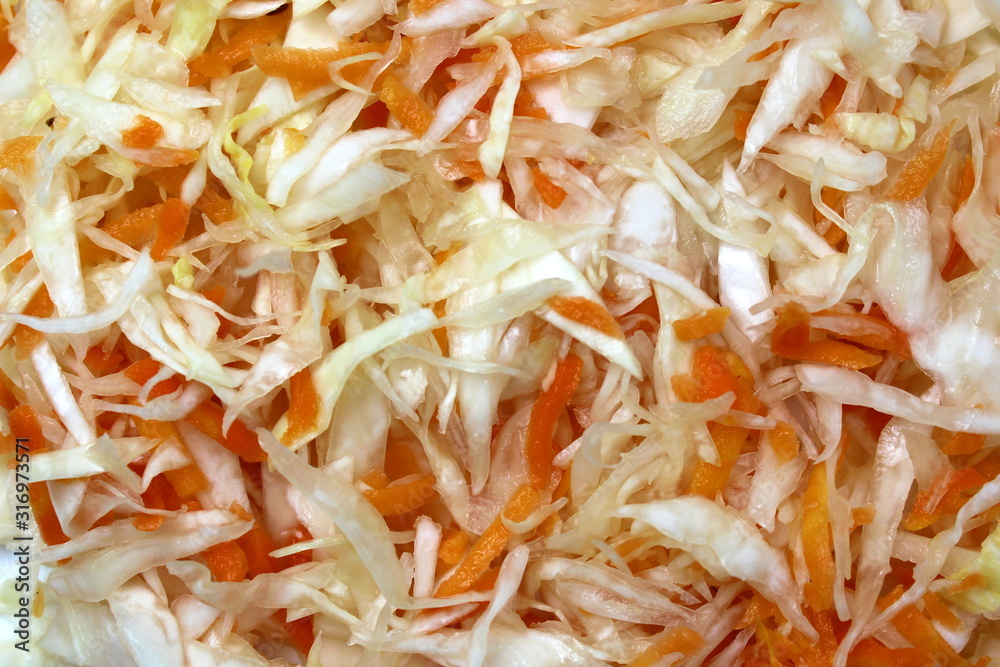 Texture shredded coleslaw with carrots sauerkraut background Texture shredded coleslaw with carrots sauerkraut background