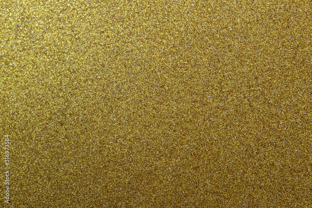 Texture shiny surface with small grains of golden colo Texture shiny surface with small grains of golden colo