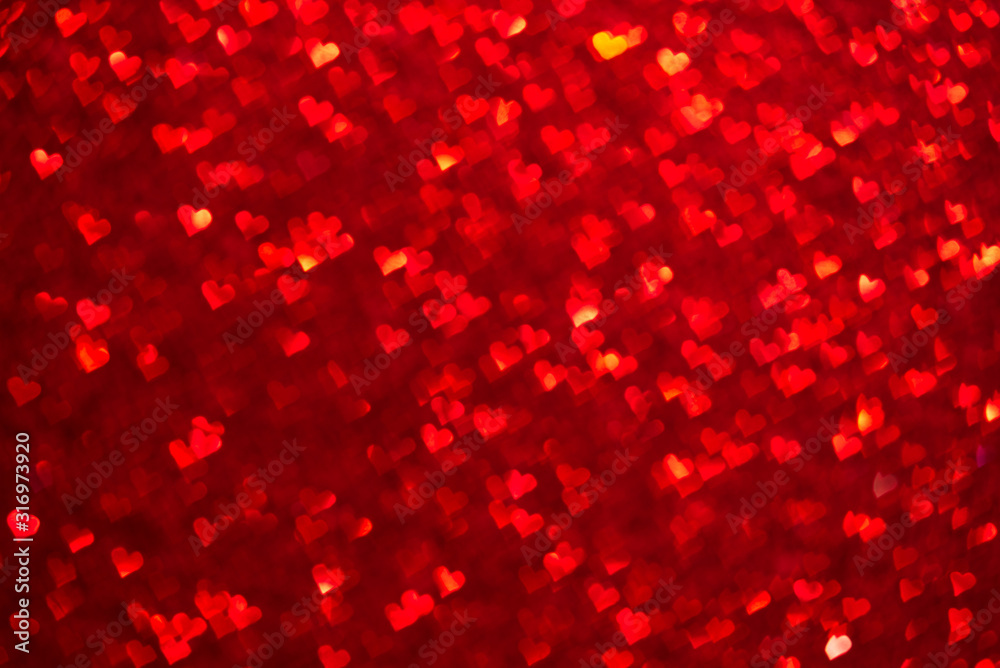 Abstract light, red bokeh pattern in heart shape. St Valentines Day or Holiday concept, background image.