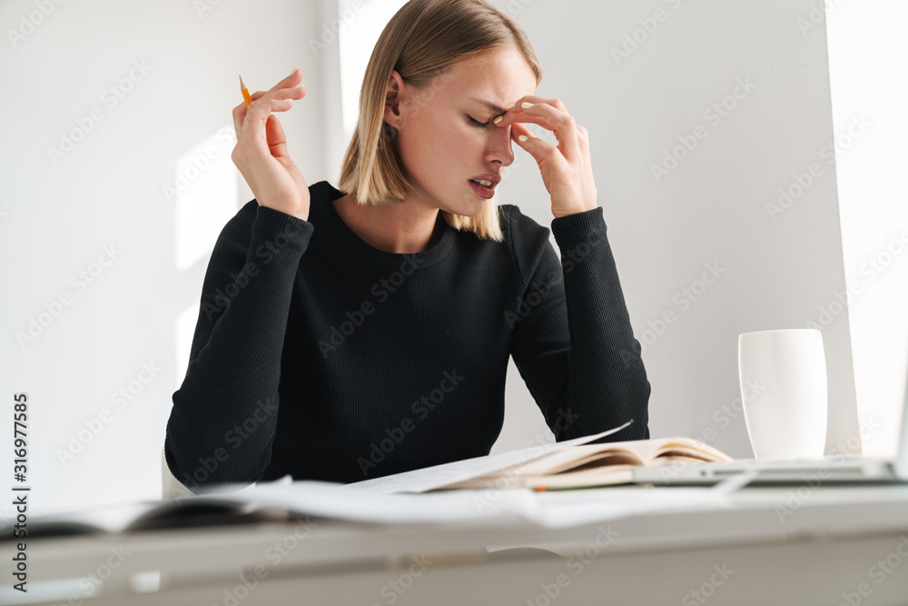 Blonde business woman in office Blonde business woman in office