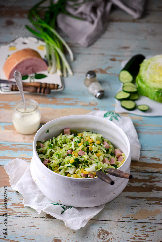 cabbage ham salad in ceramic bowl. selective focus cabbage ham salad in ceramic bowl. selective focus