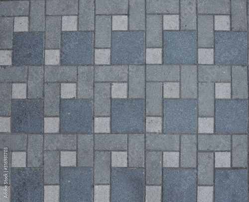 Concrete paving slabs of different sizes. Pedestrian road texture