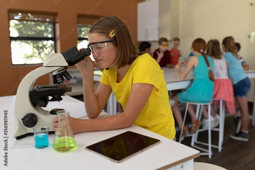 Elementary school girl in chemistry class Elementary school girl in chemistry class