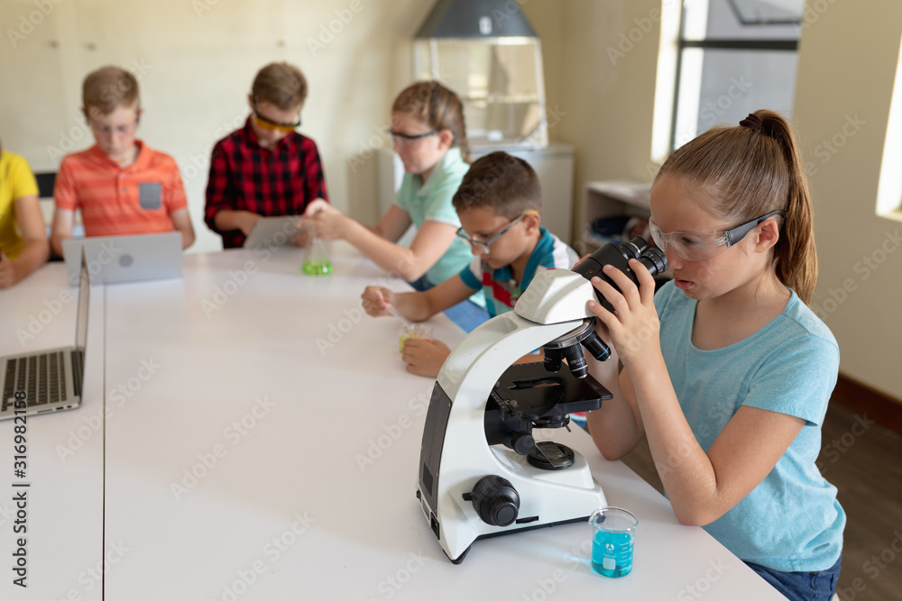 Group of elementary school kids in chemistry class Group of elementary school kids in chemistry class
