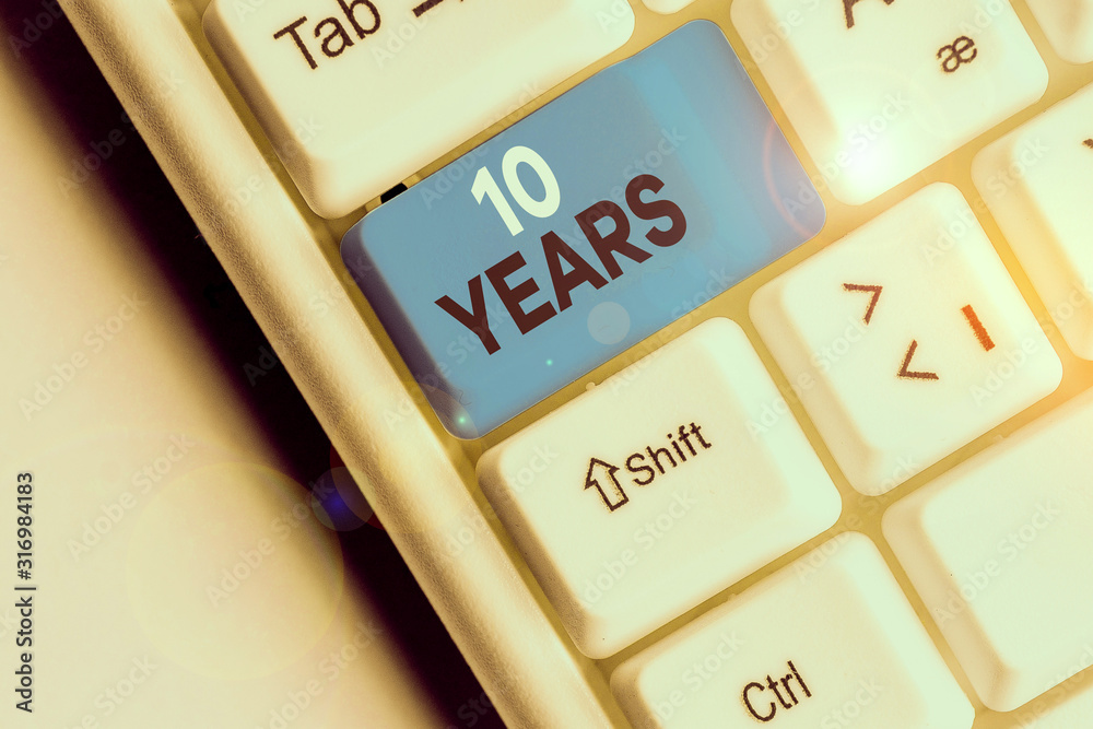 Conceptual hand writing showing 10 Years. Concept meaning Remembering or honoring special day for being 10 years in existence Conceptual hand writing showing 10 Years. Concept meaning Remembering or honoring special day for being 10 years in existence
