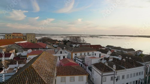 Sunset over the roofs of the old city of Faro. View from the church Largo de Se. Algarve Portugal.