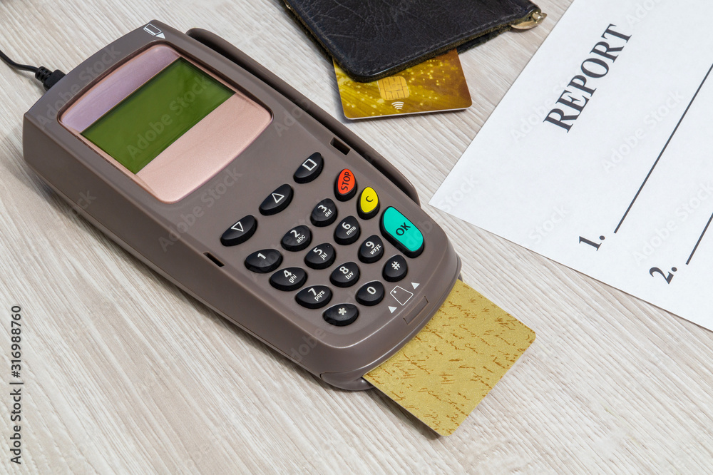 Payment terminal with card for receiving money on table Payment terminal with card for receiving money on table
