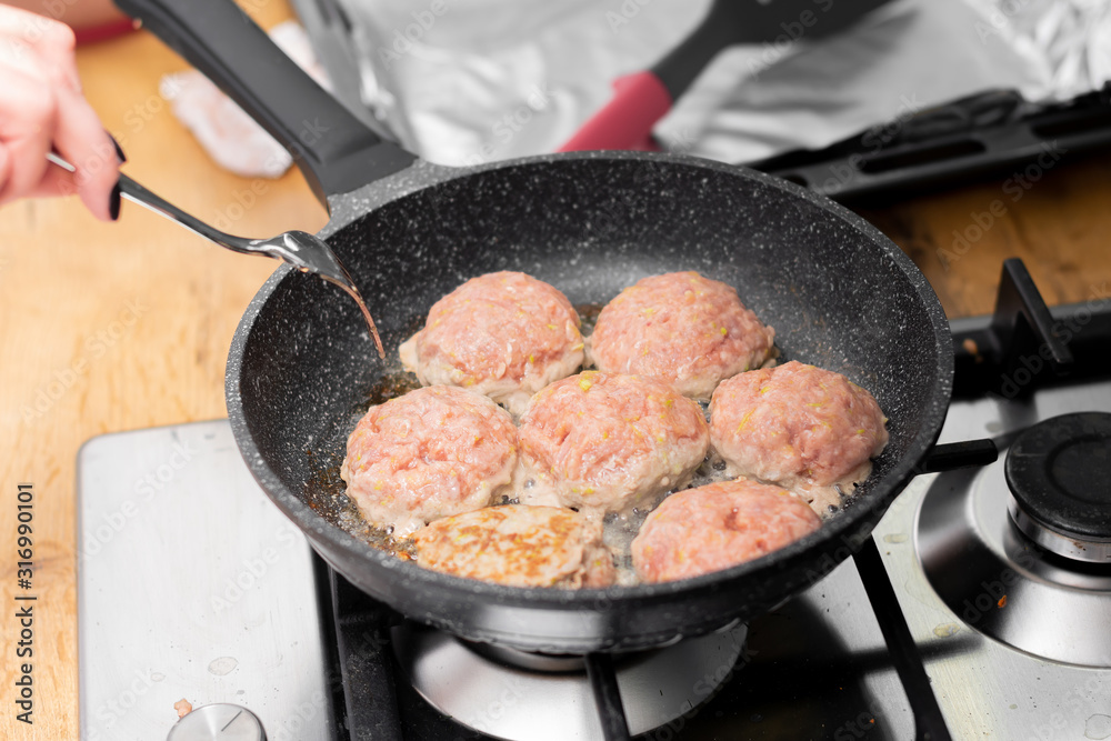 Frying pork and ground beef in a pan Frying pork and ground beef in a pan