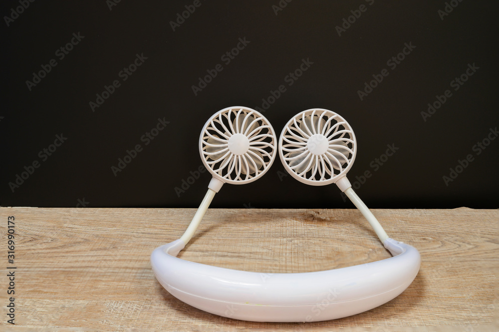 Obraz Mini Fan A portable fan that can hold your neck fototapeta, plakat