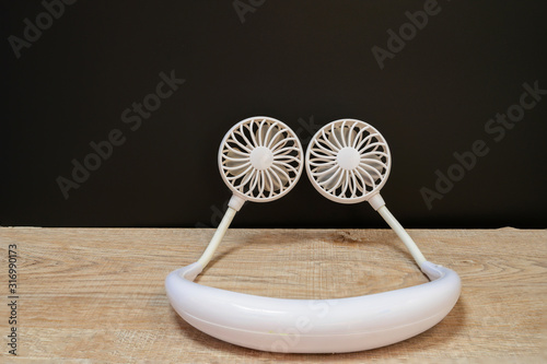 Mini Fan A portable fan that can hold your neck