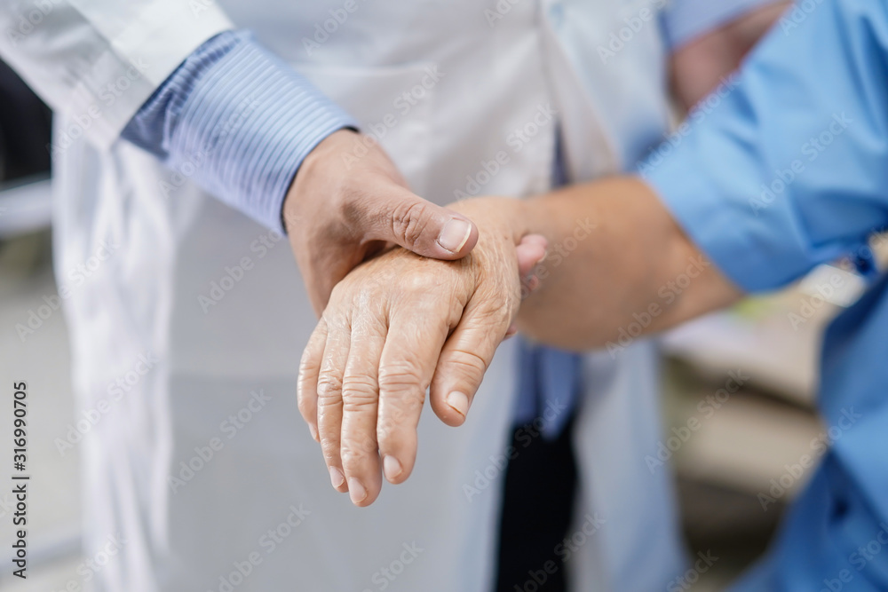 Doctor holding touching hands Asian senior or elderly old lady woman patient with love, care, helping, encourage and empathy at nursing hospital ward : healthy strong medical concept Doctor holding touching hands Asian senior or elderly old lady woman patient with love, care, helping, encourage and empathy at nursing hospital ward : healthy strong medical concept