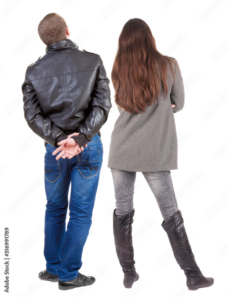 Back view of couple in winter jacket. Back view of couple in winter jacket.