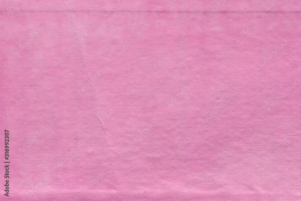 Fototapeta premium Cardboard pink abstract pattern texture close-up. Retro old paper background. Grunge concrete wall. Vintage blank wallpaper.