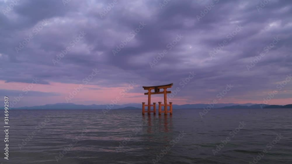 Sunset at Shirahige shrine torii gate, lake Biwa, Shiga Prefecture, Japan Sunset at Shirahige shrine torii gate, lake Biwa, Shiga Prefecture, Japan
