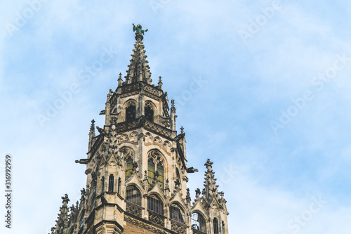 The New Town Hall, Neues Rathaus on Marienplatz main square, city government building with a tower clock. Gothic style. Photographed from below. Close up shot, texture © Kuma Media