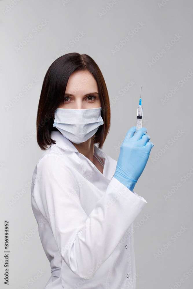 Medical injection,diseases,health care,science,diabetes.Doctor or nurse in hospital holding a syringe with liquid vaccines preparing to do an injection.Medical equipment. People in white uniform,robe.