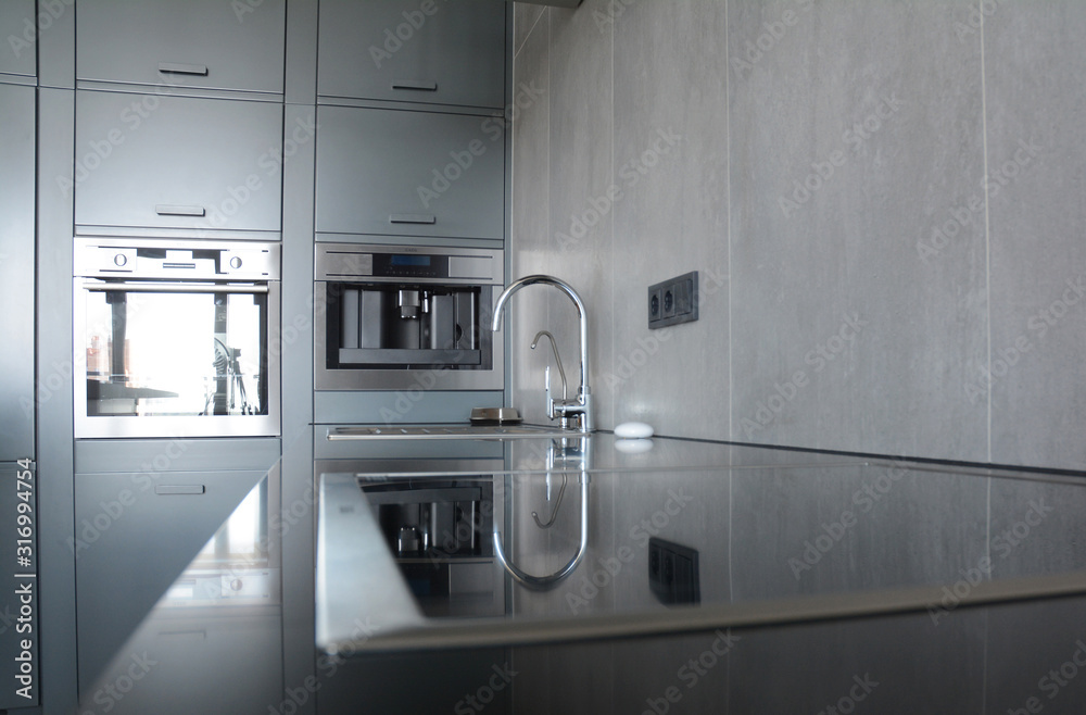 Contemporary electric kitchen oven, kitchen sink, coffee machine, water tap and chrome faucet for kitchen basin Contemporary electric kitchen oven, kitchen sink, coffee machine, water tap and chrome faucet for kitchen basin